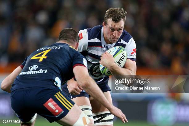 Angus Cottrell of the Rebels is challenged by Alex Ainley of the Highlanders during the round 19 Super Rugby match between the Highlanders and the...