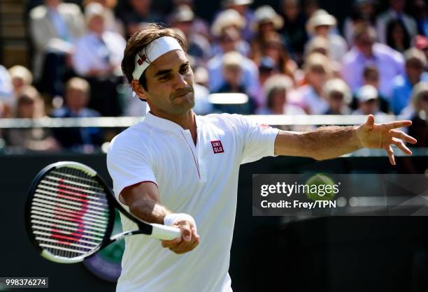 Roger Federer of Switzerland in action against Kevin Anderson of South Africa in the gentlemen's quarter finals at the All England Lawn Tennis and...