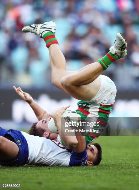 Cameron Murray of the Rabbitohs is tackled by Jeremy Marshall-King of the Bulldogs during the round 18 NRL match between the Canterbury Bulldogs and...