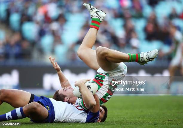 Cameron Murray of the Rabbitohs is tackled by Jeremy Marshall-King of the Bulldogs during the round 18 NRL match between the Canterbury Bulldogs and...