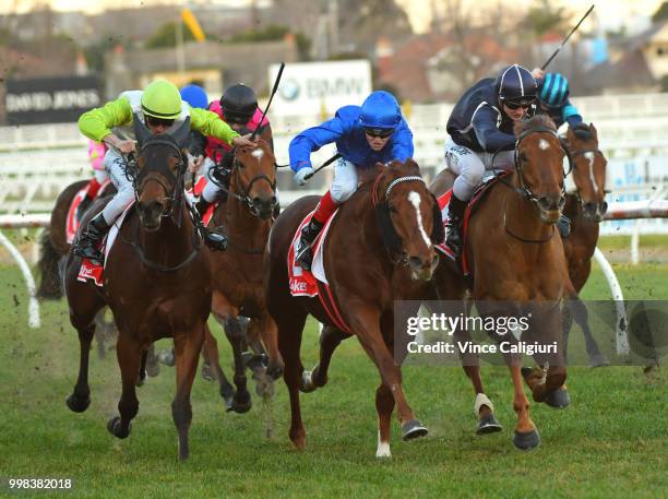 Craig Williams riding Malaise defeats Mitchell Aitken riding Widgee Turf and Call Me Handsome in Race 9, during Melbourne Racing at Caulfield...