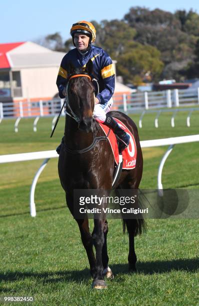 Dwayne Dunn riding Brutal after winning Race 1 during Melbourne Racing at Caulfield Racecourse on July 14, 2018 in Melbourne, Australia.