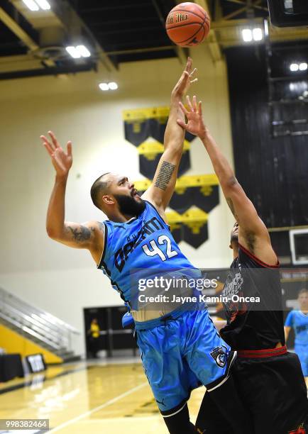Kyle Austin of the Kimchi Express fouls Cameron Forte of Dubois Dream as goes for a basket during the game at Eagle's Nest Arena on July 13, 2018 in...