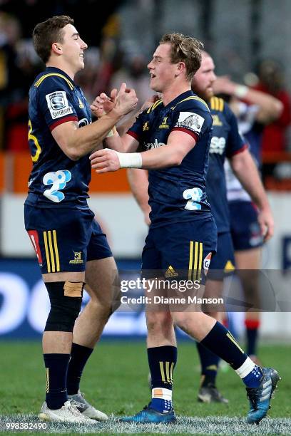 Josh McKay and Josh Renton of the Highlanders celebrate defeating the Rebels in the round 19 Super Rugby match between the Highlanders and the Rebels...