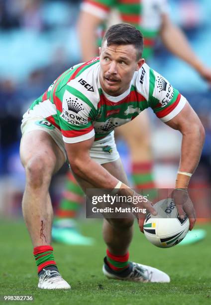 Damien Cook of the Rabbitohs passes during the round 18 NRL match between the Canterbury Bulldogs and the South Sydney Rabbitohs at ANZ Stadium on...