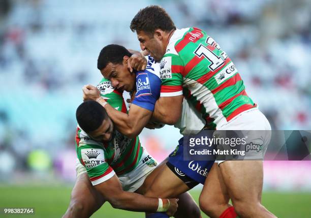 Will Hopoate of the Bulldogs is tackled during the round 18 NRL match between the Canterbury Bulldogs and the South Sydney Rabbitohs at ANZ Stadium...