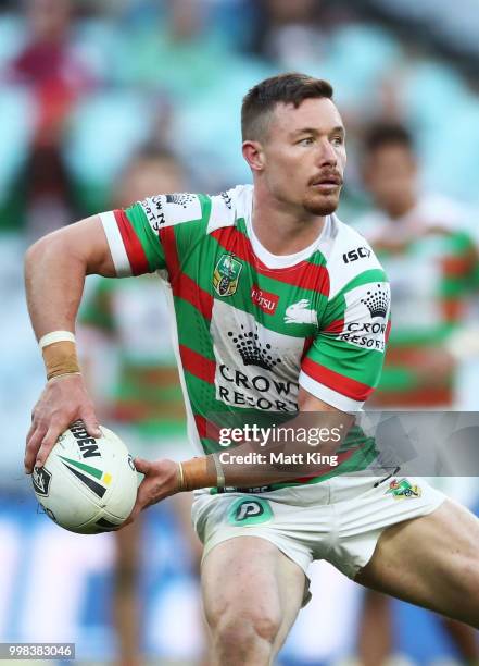 Damien Cook of the Rabbitohs passes during the round 18 NRL match between the Canterbury Bulldogs and the South Sydney Rabbitohs at ANZ Stadium on...