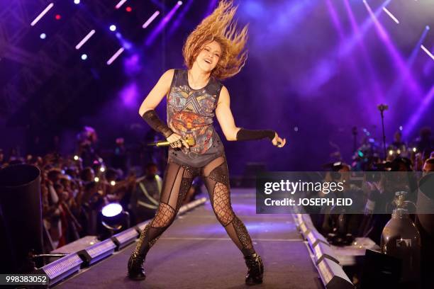 Colombian singer Shakira performs at the grand opening of the Cedars International Festival in northern Lebanon on July 13, 2018. / RESTRICTED TO...