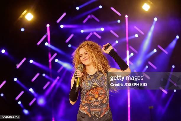 Colombian singer Shakira performs at the grand opening of the Cedars International Festival in northern Lebanon on July 13, 2018. - - RESTRICTED TO...