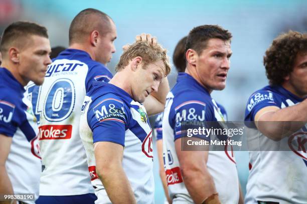 Aiden Tolman of the Bulldogs and team mates look dejected after a Rabbitohs try during the round 18 NRL match between the Canterbury Bulldogs and the...