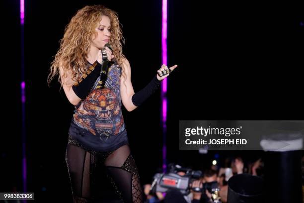 Colombian singer Shakira performs at the grand opening of the Cedars International Festival in northern Lebanon on July 13, 2018. / RESTRICTED TO...