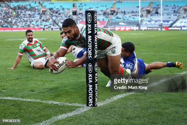 Robert Jennings of the Rabbitohs scores in the corner during the round 18 NRL match between the Canterbury Bulldogs and the South Sydney Rabbitohs at...