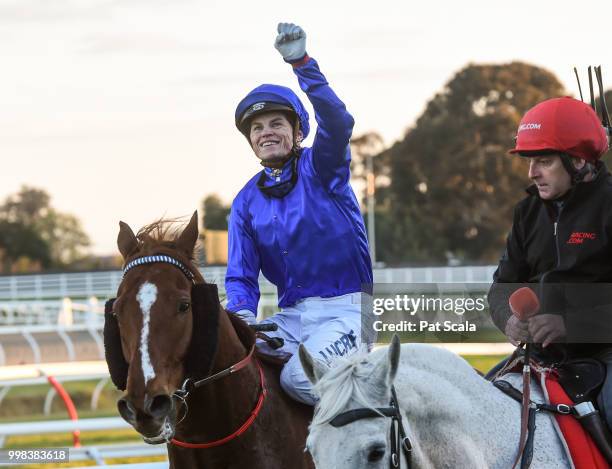 Craig Williams returns to the mounting yard on Malaise after winning the Ladbrokes Cash Out Handicap ,at Caulfield Racecourse on July 14, 2018 in...