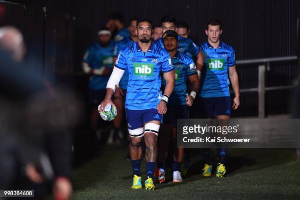 Jerome Kaino of the Blues leads his team onto the field prior to the round 19 Super Rugby match between the Crusaders and the Blues at AMI Stadium on...