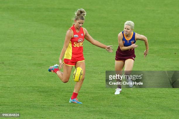 Paige Parker of the Suns kicks during the AFLW Winter Series match between the Gold Coast Suns and the Brisbane Lions at Metricon Stadium on July 14,...