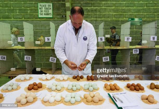 Richard Bett judges eggs during the final day of the 160th Great Yorkshire Show on July 12, 2018 in Harrogate, England. First held in 1838 the show...