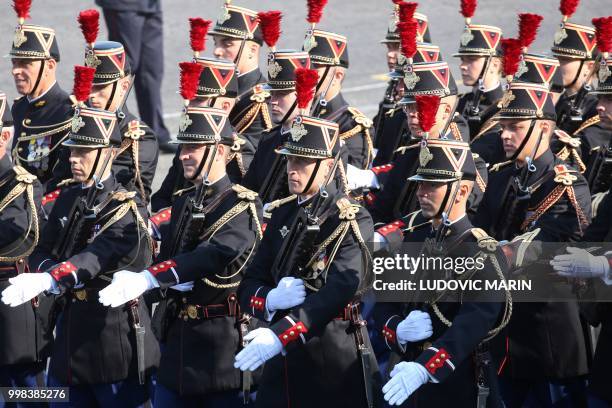 French Republican Guards are seen during preparations for the annual Bastille Day military parade on the Champs-Elysees avenue in Paris on July 14,...