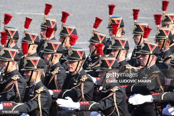 French Republican Guards are seen during preparations for the annual Bastille Day military parade on the Champs-Elysees avenue in Paris on July 14,...