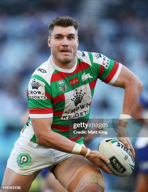 Angus Crichton of the Rabbitohs passes during the round 18 NRL match between the Canterbury Bulldogs and the South Sydney Rabbitohs at ANZ Stadium on...