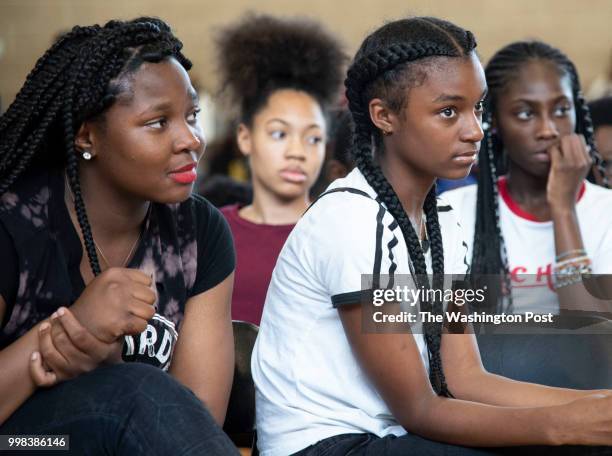 Makiya Graham 15, and Mia Gibbs tear up during their friend's testimony at a community meeting regarding the police stop and frisk policy on July 12,...