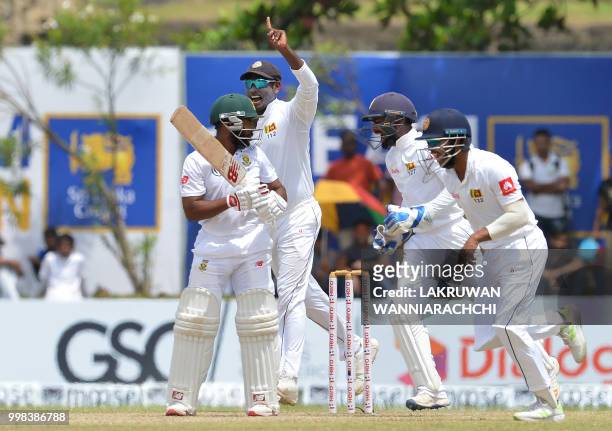 Sri Lanka's celebrates after the dismissmal of South Africa's Temba Bavuma during the third day of the opening Test match between Sri Lanka and South...