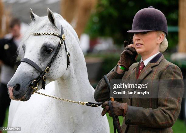 Competitor speaks on her phone as she waits to compete during the final day of the 160th Great Yorkshire Show on July 12, 2018 in Harrogate, England....