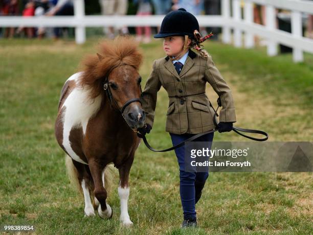 Alex Kersey from Rotherham competes with her miniature Shetland pony during the final day of the 160th Great Yorkshire Show on July 12, 2018 in...