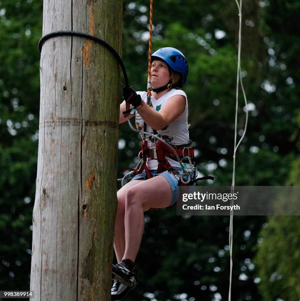 Emma Cakebread takes part in the Pole Climbing Championship during the final day of the 160th Great Yorkshire Show on July 12, 2018 in Harrogate,...