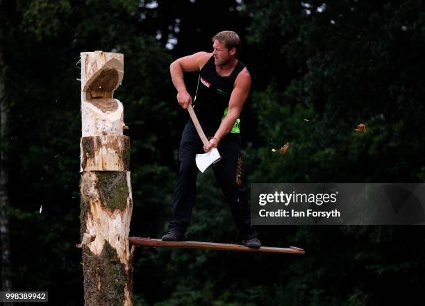 Member of the Cumbrian Axemen demonstrates wood cutting techniques during the final day of the 160th Great Yorkshire Show on July 12, 2018 in...