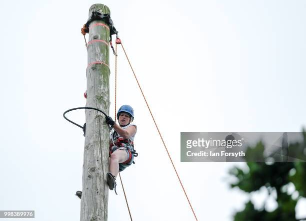 Emma Cakebread takes part in the Pole Climbing Championship during the final day of the 160th Great Yorkshire Show on July 12, 2018 in Harrogate,...