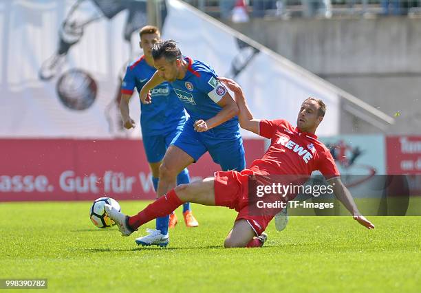 Gaetano Manno of Wuppertal and Matthias Lehmann of Koeln battle for the ball during the friendly match between Wuppertaler SV and 1. FC Koeln on July...