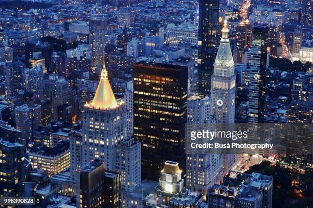 spectacular panoramic view from atop the empire state building at twilight: madison square park with the metlife insurance company tower. new york city, usa - metlife building stock pictures, royalty-free photos & images