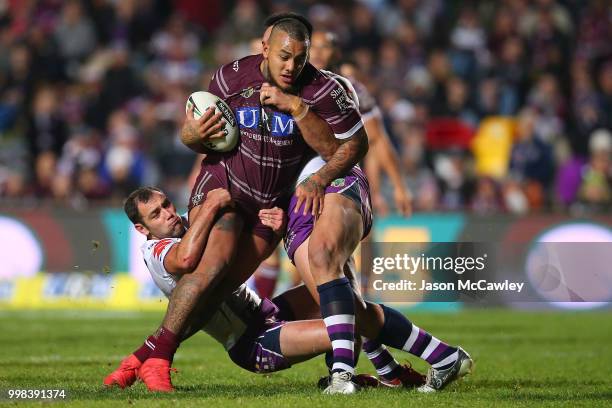 Addin Fonua-Blake of the Sea Eagles is tackled by Cameron Smith of the Storm during the round 18 NRL match between the Manly Sea Eagles and the...