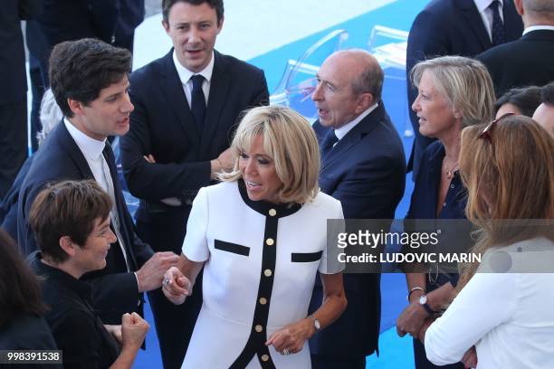 French President's wife Brigitte Macron stands with French Overseas Minister Annick Girardin, French Junior Minister for the Territorial Cohesion...