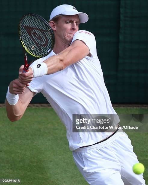 Mens Singles, Semi-Final - Kevin Anderson v John Isner - Kevin Anderson returns the ball awkwardly at All England Lawn Tennis and Croquet Club on...