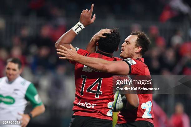 Seta Tamanivalu of the Crusaders is congratulated by Israel Dagg of the Crusaders after scoring a try during the round 19 Super Rugby match between...