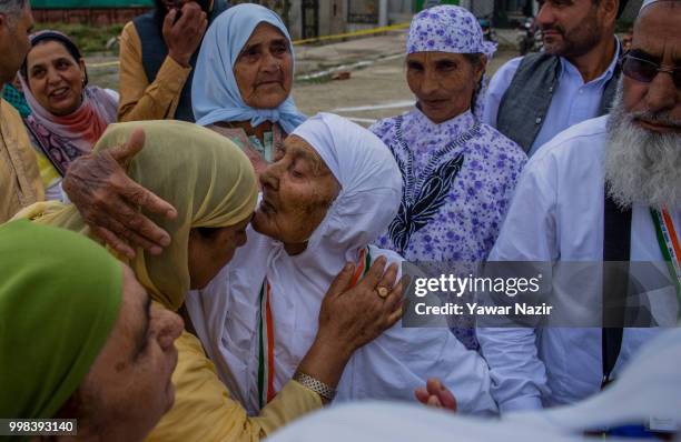 Saja Begum kisses her relative before departing for the annual Hajj pilgrimage to Mecca on July 14, 2018 in Srinagar, the summer capital of Indian...