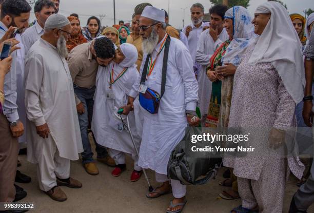 Saja Begum kisses her relative before departing for the annual Hajj pilgrimage to Mecca on July 14, 2018 in Srinagar, the summer capital of Indian...