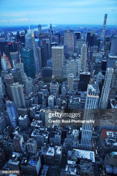 spectacular bird's eye view of manhattan at twilight: times square, general electric building, rockefeller center, 432 park avenue. new york city, usa - 432 park avenue stock pictures, royalty-free photos & images