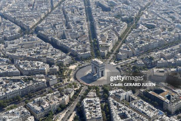 Aerial view of the Arc de Triomphe prior to the annual Bastille Day military parade on the Champs-Elysees avenue in Paris on July 14, 2018.