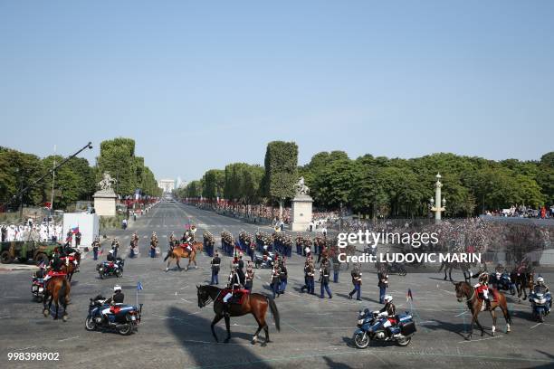 French Republican Guards perform at Place de la Concorde during the annual Bastille Day military parade in Paris on July 14, 2018.