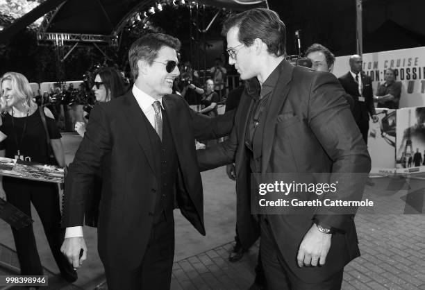 Tom Cruise and Henry Cavill attends the "Mission: Impossible - Fallout" UK premiere on July 13, 2018 in London, England.