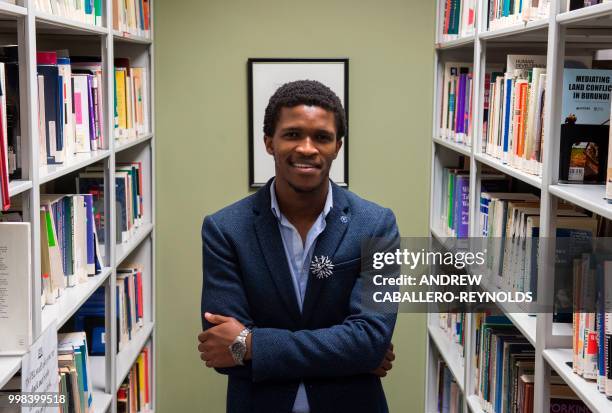 Siyabulela Mandela, grandson of Nelson Mandela, poses during a photo session in a library at George Mason University before an interview with AFP in...