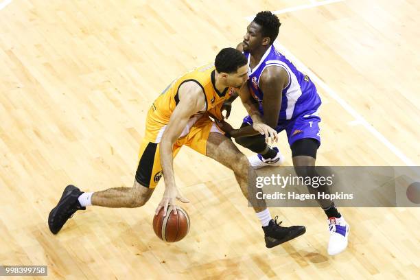 Peak of the Saints defends against Xavier Smith of the Mountainairs during the NZNBL match between Wellington Saints and Taranaki Mountainairs at TSB...