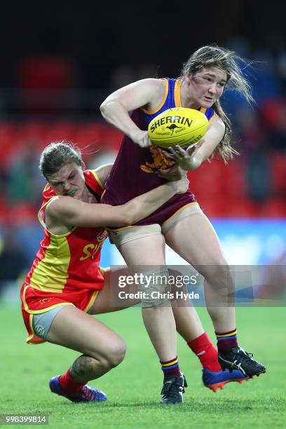 Ruby Blair of the Lions is tackled during the AFLW Winter Series match between the Gold Coast Suns and the Brisbane Lions at Metricon Stadium on July...