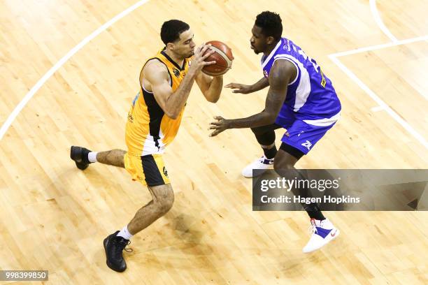 Peak of the Saints defends against Xavier Smith of the Mountainairs during the NZNBL match between Wellington Saints and Taranaki Mountainairs at TSB...