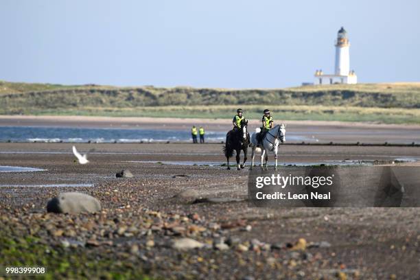 Mounted police patrol the beach area outside near Trump Turnberry Luxury Collection Resort during the U.S. President's visit to the United Kingdom on...