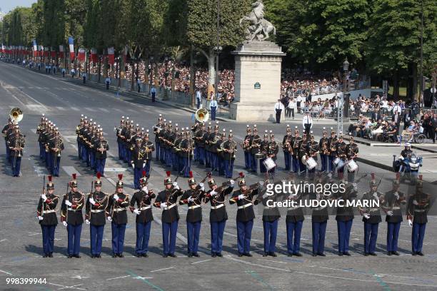 French Republican Guards perform at Place de la Concorde during the annual Bastille Day military parade in Paris on July 14, 2018.