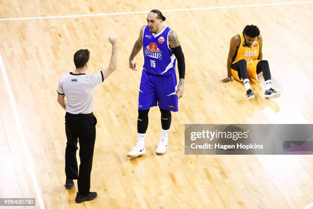 Leon Henry of the Saints appeals to an official after fouling Alonzo Burton of the Mountainairs during the NZNBL match between Wellington Saints and...