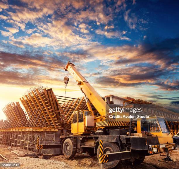 crane on the viaduct construction site - bridge construction stock pictures, royalty-free photos & images